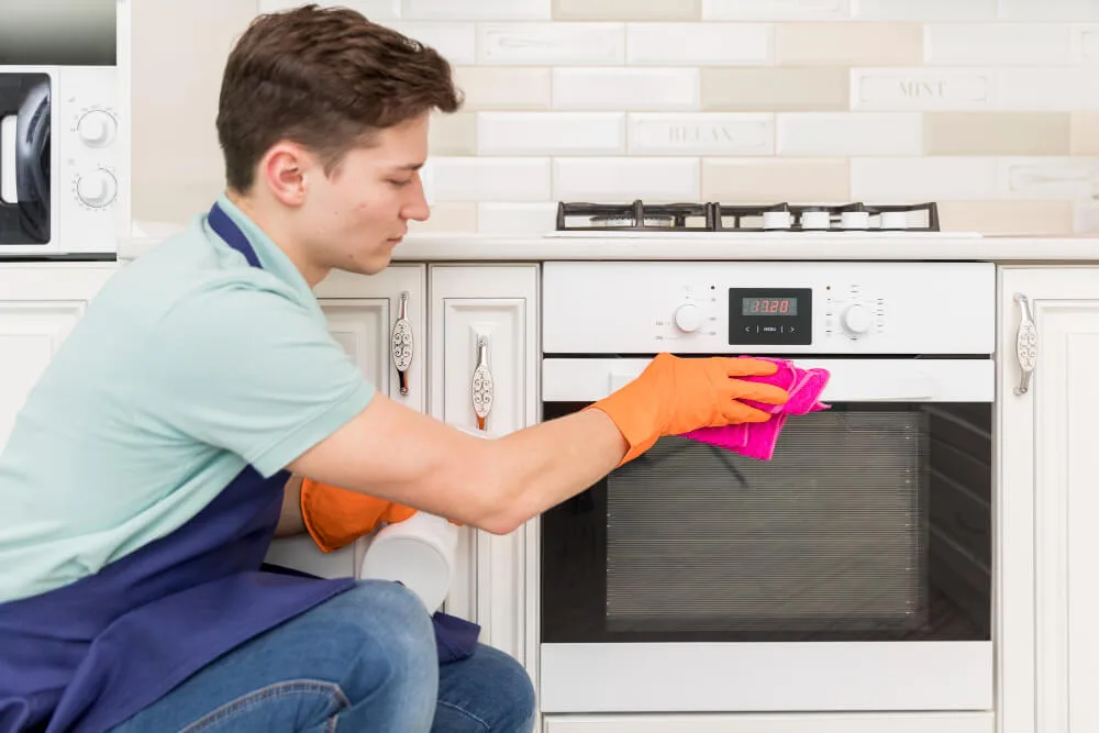 Cleaning grease and grime from an oven